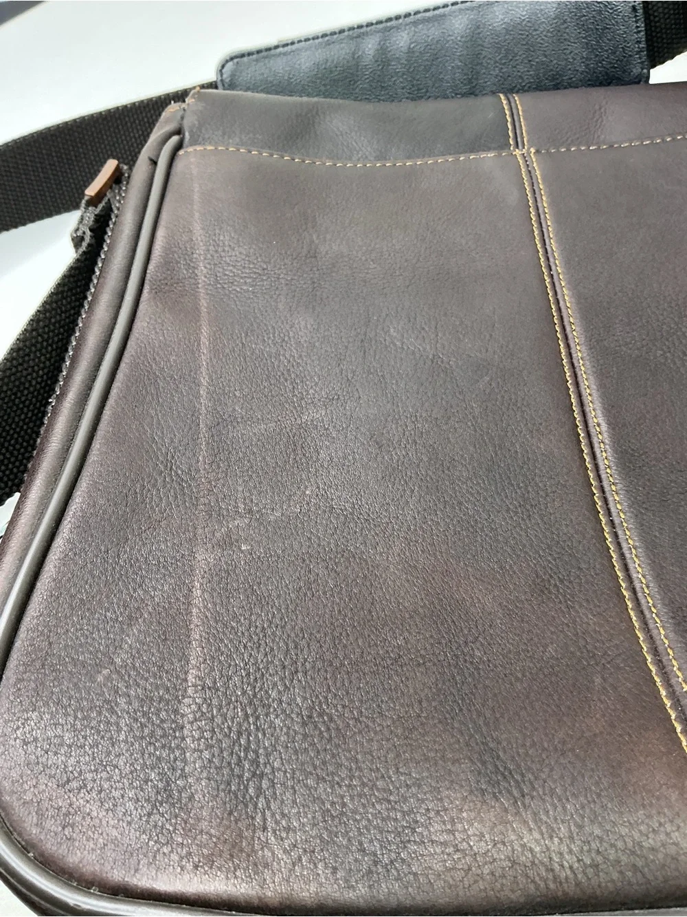 Kenneth Cole Reaction dark brown leather messenger-style tablet bag.